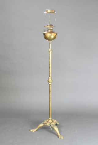 An Art Nouveau brass adjustable oil lamp converted to electricity 