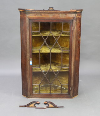 A 19th Century mahogany hanging corner cabinet with moulded cornice, fitted shelves enclosed by astragal glazed panelled doors 113cm h x 75cm w x 46cm d 