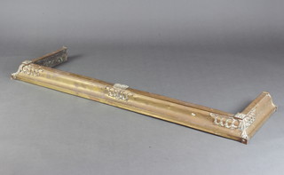 An Art Nouveau brass fire curb 12cm h x 137cm w x 39cm d 