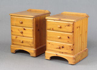 A pair of Ducal pine bedside chests with raised backs fitted 3 long drawers with tore handles 64cm h x 47cm w x 45cm w 