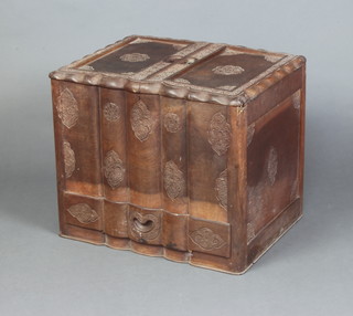 A Burmese carved hardwood surprise cabinet, the base fitted a drawer 47cm h x 56cm w x 44cm d 