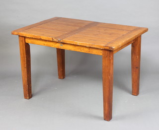 A rectangular hardwood extending dining table with concealed extra leaf 78cm h x 120cm l x 80cm w 