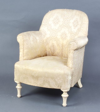 A 1950's tub back chair upholstered in yellow material raised on turned supports 
