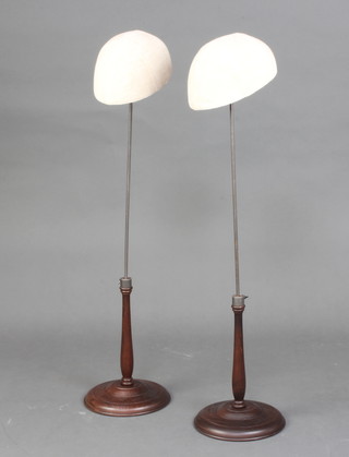 Two milliners turned wooden and steel adjustable hat display stands 83cm h x 20cm x 26cm 
