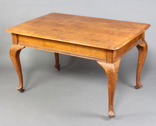 An Edwardian rectangular light oak library/dining table raised on cabriole supports 79cm h x 136cm l x 91cm w  