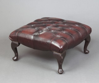 A Georgian style square stool upholstered in brown buttoned leather, raised on cabriole supports 30cm h x 56cm 