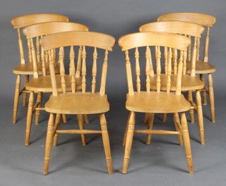 A set of 6 pine stick and rail back Windsor dining chairs 