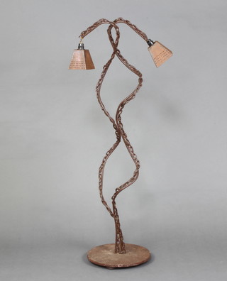 An iron sculpture 2 light standard lamp formed from chain, raised on a circular base 114cm h x 30cm 
