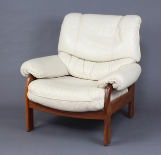 A teak and white leather armchair 