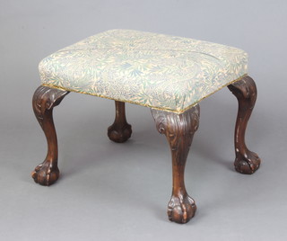 A Georgian style carved mahogany footstool with over stuffed seat, raised on cabriole, ball and claw supports 44cm h x 56cm w x 46cm d 