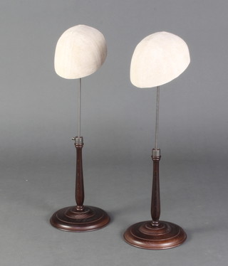 Two milliner's metal and turned mahogany hat display stands 67cm h 