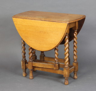 A light oak drop flap gateleg tea table raised on turned supports 73cm h x 76cm w x 40cm 