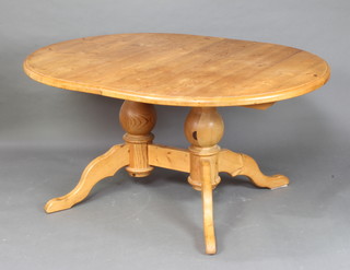 A pine oval extending dining table 78cm h x 120cm w x 156cm l 
