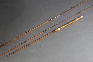 An Allcocks Lucky Strike split cane fishing rod and a Black Seal rod 