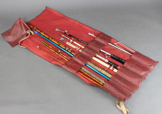 2 bamboo fishing rods, a Viking fishing rod, 1 other rod and a landing net 