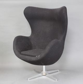 After Arne Jacobsen, a revolving egg chair upholstered in black felt material 119cm h x 78cm w 