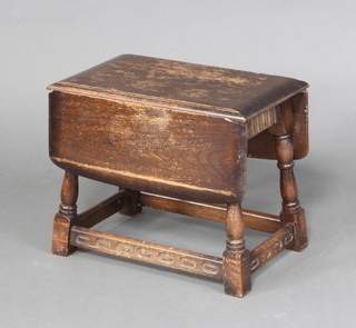 An oak drop flap occasional table raised on turned and block supports 40cm h x 50cm w x 30cm 