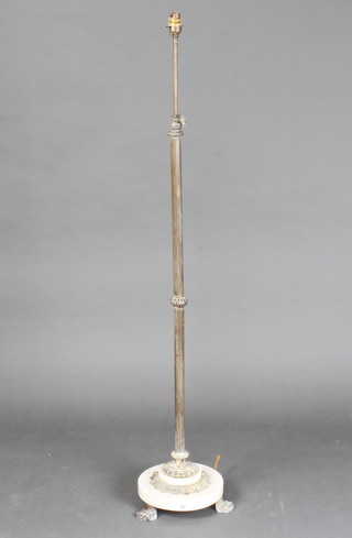 An onyx and reeded gilt metal standard lamp 