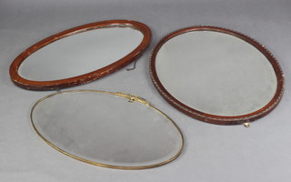 An oval bevelled plate wall mirror contained in a pierced gilt metal frame 43cm x 69cm, 2  oval mirrors in mahogany frames 46cm x 75cm and 59cm x 76cm and other mirrors 