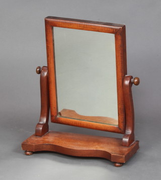A Victorian rectangular plate dressing table mirror contained in a mahogany swing frame 45cm x 38cm x 15cm 