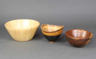 A circular turned oak bowl, the base marked Oak Polesden Lacey 1995 19cm x 26cm together with 2 turned bowls 18cm x 40cm and 13cm x 30cm 