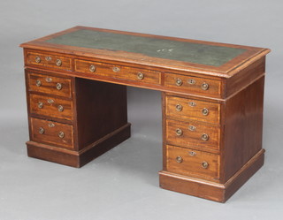 An Edwardian inlaid mahogany desk with inset writing surface above 1 long and 8 short drawers with ring drop handles 73cm h x 140cm w x 60cm d 