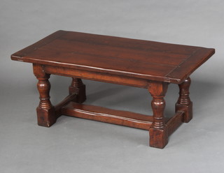 A 17th/18th Century style rectangular oak coffee table, the top formed of 3 planks, raised on turned and block supports 45cm h x 107cm l x 56cm w  