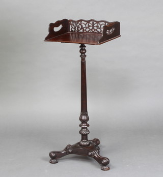 A William IV style twin handled mahogany book stand with pierced gallery raised on a turned column and triform base  87cm h x 37cm w x 27cm d 