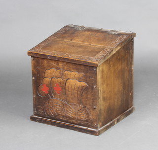 A 1930's oak carved oak coal box with hinged lid, the front decorated a galleon  42cm x 40cm x 40cm 