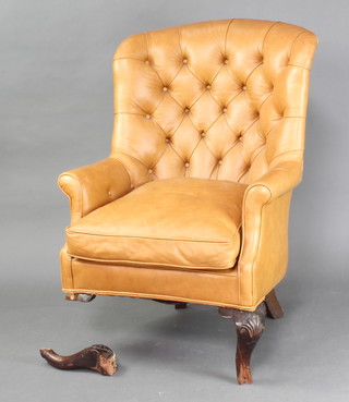 A Georgian style tub back armchair upholstered in light buttoned leather, raised on cabriole supports (f) 
