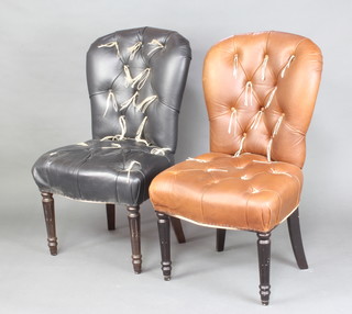 Two Victorian style dining chairs upholstered in black and brown leather, raised on turned and fluted supports 