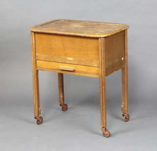A 1930's rectangular oak sewing box with hinged lid, the base fitted a drawer complete with contents 62cm h x 54cm w x 36cm d 