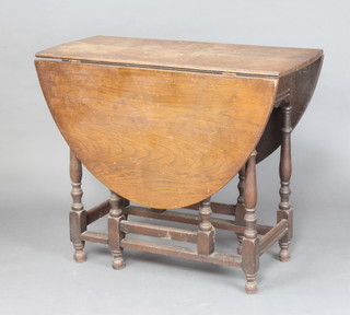 A 17th Century style oak oval drop flap gateleg tea table raised on turned supports 76cm h x 90cm w x 42cm d 
