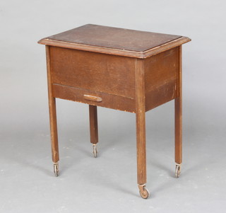 A 1930's rectangular oak sewing box with hinged lid and drawer to base 62cm h x 56cm w x 37cm d 