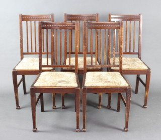 A set of 5 Shoolbred 1930's mahogany stick and bar back dining chairs with upholstered drop in seats  