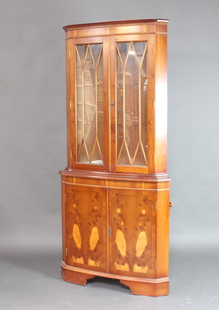 A Georgian style inlaid yew double corner cabinet 185cm h x 87cm w x 49cm d