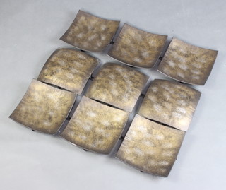 A rectangular pressed metal sculpture of panel form 64cm x 66cm 