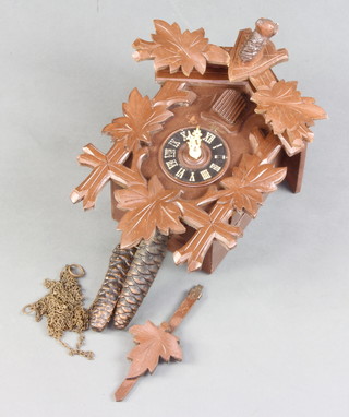 A carved wooden cuckoo clock 