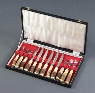 A set of 6 steak knives with stag horn handles, cased