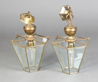 A pair of hexagonal gilt metal and glass hanging lanterns 22cm x 24cm 
