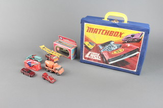 A Matchbox plastic car carrier and a small collection of toy cars 