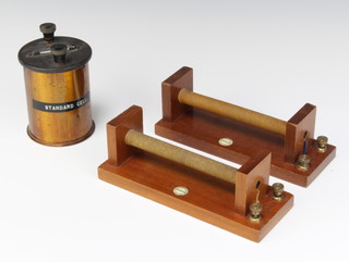 F E Brecker and Co. a Cadmium standard cell no.937 together with 2 Philip Harris and Co. coils 