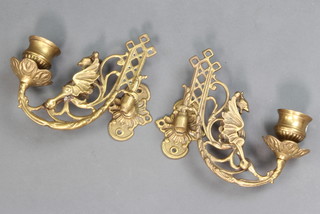 A pair of Art Nouveau pierced brass candlestick sconces 