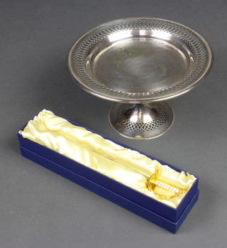 A paper knife in the form of a Naval Officer's sword and a pierced silver plated comport 