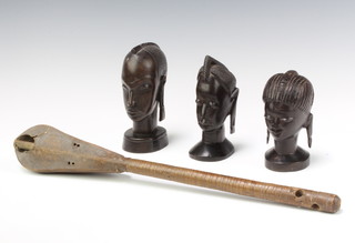 Three African carved head and shoulder portrait busts of ladies 13cm x 7cm x 5cm, 12cm x 5cm x 7cm and 14cm x 7cm x 6cm together with an Eastern stringed instrument 