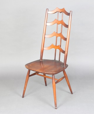 An Ercol elm and beech ladderback chair with solid seat raised on turned supports 