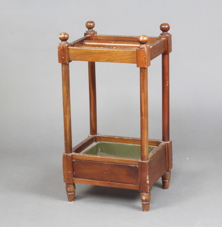 A mahogany rectangular 3 section umbrella stand, raised on turned supports complete with drip tray 69cm h x 36cm x 28cm 