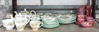A part Copeland Spode Byron pattern tea service together with a red glazed Baron Barnstable coffee service 