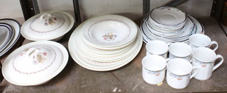 A part Royal Doulton Woodland pattern dinner service together with a part Royal Doulton Juno dinner service 