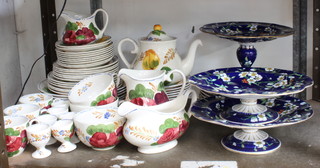 A part Chanticleer Ware  Belle Flore pattern tea/dinner service and a blue and floral patterned dessert service comprising 3 comports and plates 